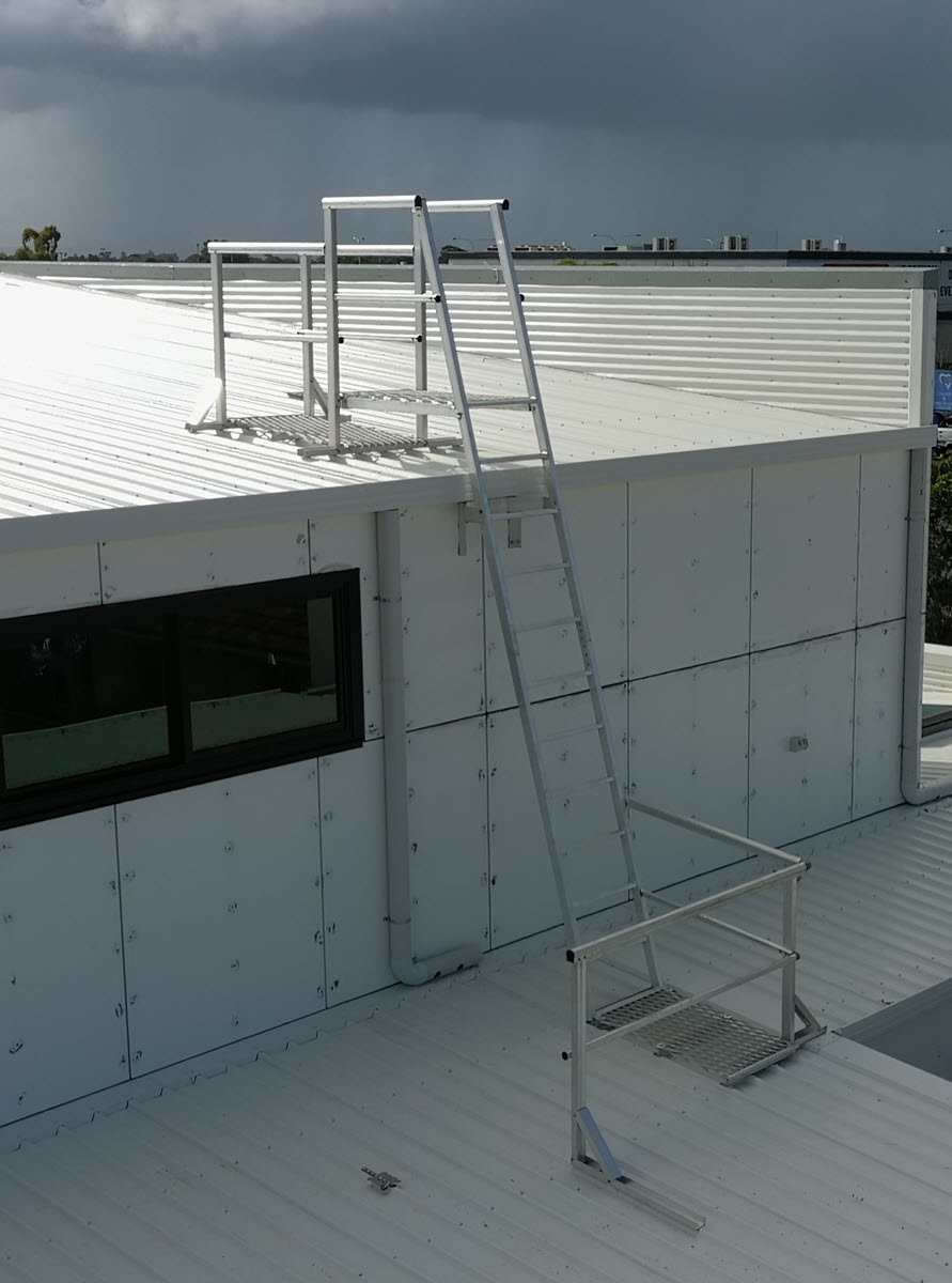 Ladder access between two roofs.